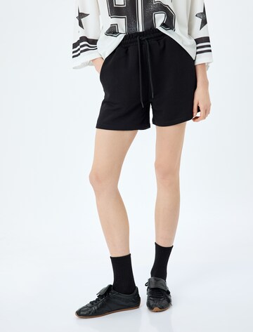Koton Loose fit Pants in Black: front