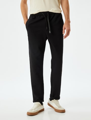 Koton Loose fit Trousers in Black: front