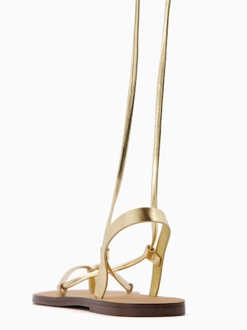 Tongs Bershka en or