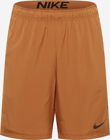 Pantalon de sport NIKE en marron : devant