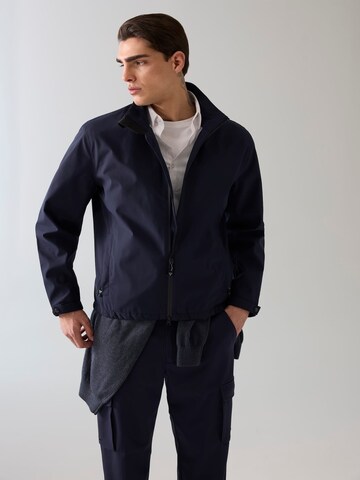 GUESS Performance Jacket in Blue: front