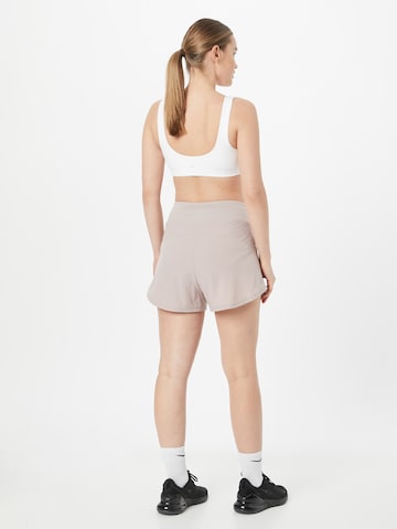 Regular Pantalon de sport 'BLISS' NIKE en gris