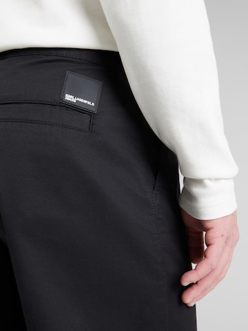 juoda KARL LAGERFELD JEANS Laisvas Klostuotos kelnės