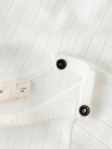 Tutina / body per bambino di Lil'Atelier in bianco