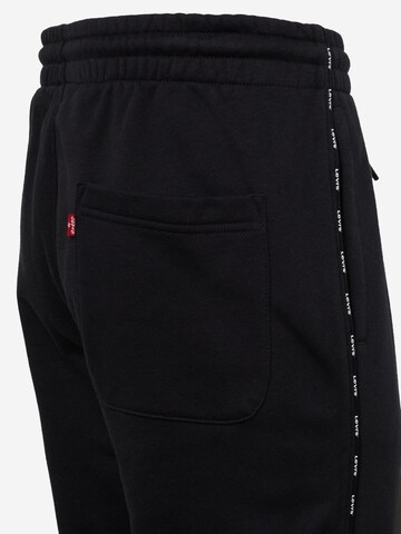 juoda LEVI'S ® Siaurėjantis Kelnės 'Graphic Piping Sweatpant'