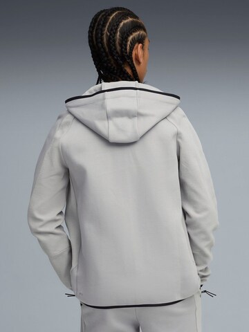 PUMA - Sudadera con cremallera 'Puma Evostripe Fz Hoodie Dk' en gris