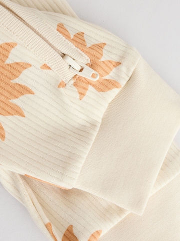 Next Strampler in Beige