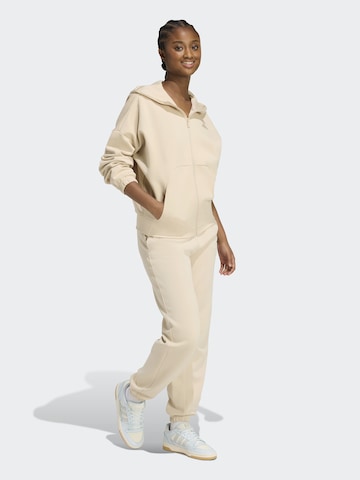 Effilé Pantalon de sport 'FI' ADIDAS SPORTSWEAR en beige : devant