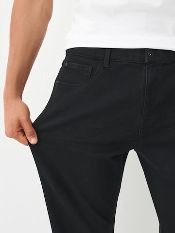 Next Slimfit Jeans 'Essential' in Zwart