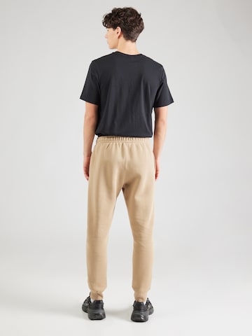 Tapered Pantaloni de la Nike Sportswear pe bej