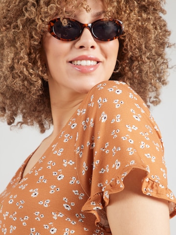 ABOUT YOU Curvy - Camiseta 'Glenn' en naranja