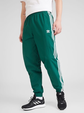ADIDAS ORIGINALS Tapered Trousers in Green: front