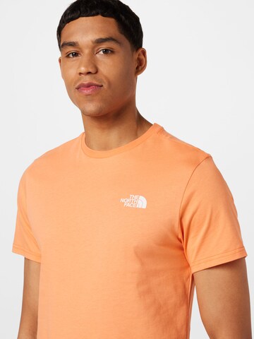 THE NORTH FACE Regularny krój Koszulka 'Simple Dome' w kolorze pomarańczowy