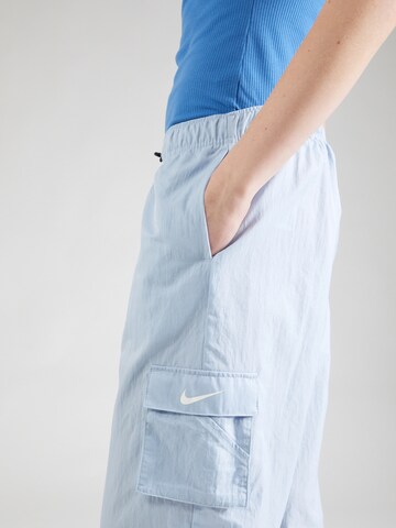 Nike Sportswear Loosefit Cargobroek 'ESSNTL' in Blauw