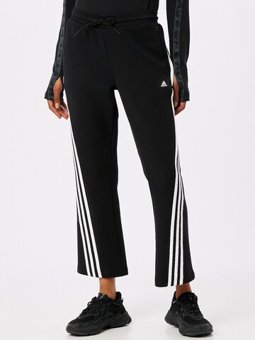 ADIDAS SPORTSWEAR Flared Workout Pants in Black: front