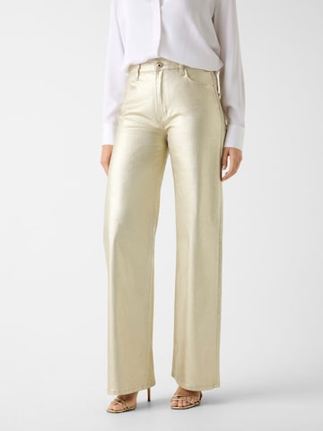 GUESS Wide leg Jeans in Gold: front
