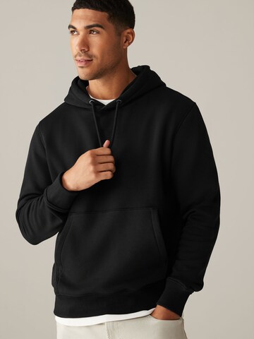 Next Sweatshirt i svart: framsida