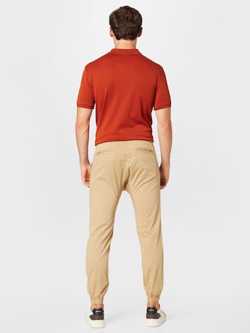 Cotton On Zwężany krój Spodnie 'Drake' w kolorze beżowy