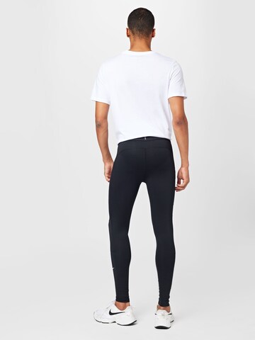 NIKE Skinny Sporthose in Schwarz