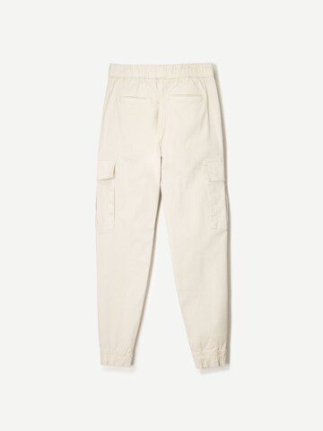 Effilé Pantalon cargo Bershka en beige