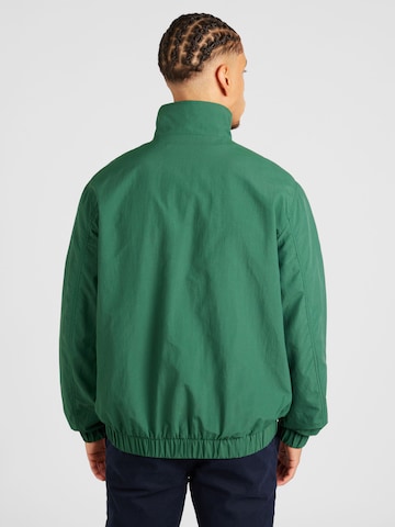 Tommy Jeans Φθινοπωρινό και ανοιξιάτικο μπουφάν 'ESSENTIAL' σε πράσινο