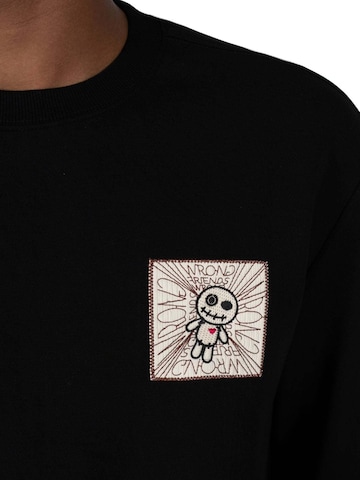 WRONG FRIENDS Sweatshirt 'Rio Bravo' in Schwarz