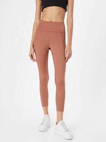 Girlfriend Collective Skinny Workout Pants in Brown: front