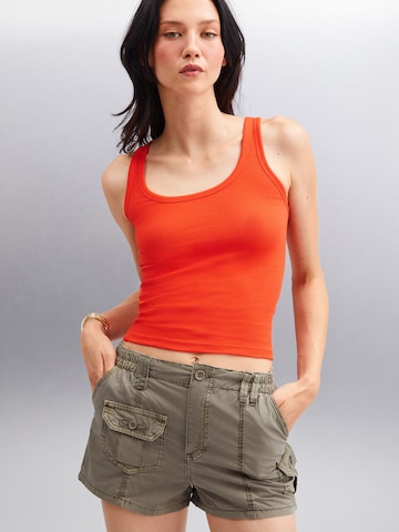 Haut Grimelange en rouge : devant