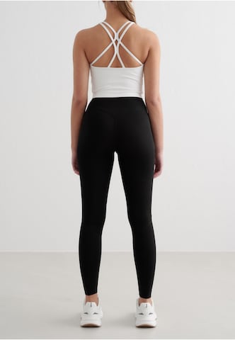 Top sportivo di Aim'n in bianco