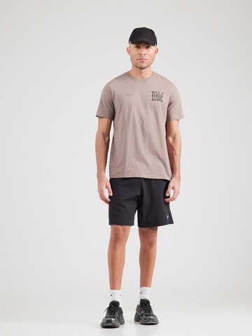 T-Shirt 'WE FLOAT' Nike Sportswear en marron