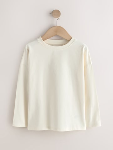 Tricou de la Next pe bej