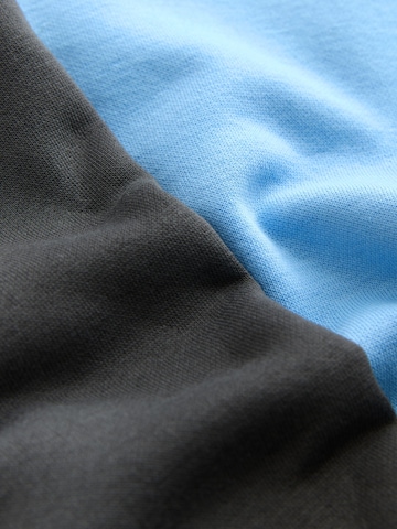 Next Träningsoverall i blå