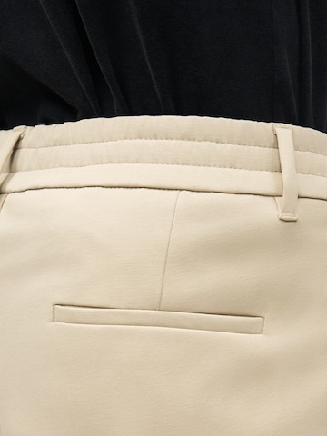 smėlio DRYKORN Standartinis Kelnės su kantu 'CHASY'