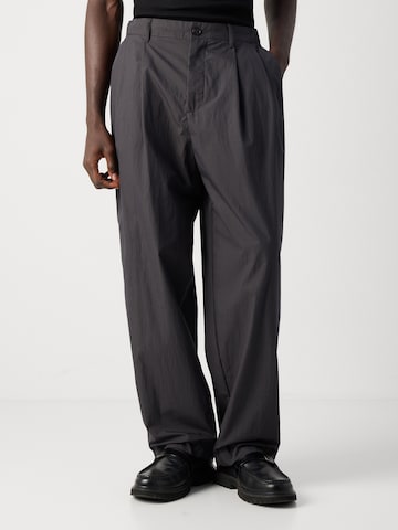 Calvin Klein Baggy Pleat-front trousers in Grey: front