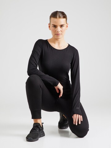 Effilé Pantalon de sport 4F en noir