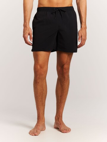 Shorts de bain 'Faster' PROTEST en noir