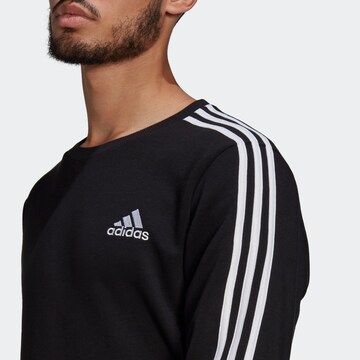 ADIDAS SPORTSWEAR Urheilullinen collegepaita 'Essentials Fleece 3-Stripes' värissä musta