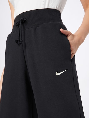 Nike Sportswear Zwężany krój Spodnie 'PHNX FLC' w kolorze czarny