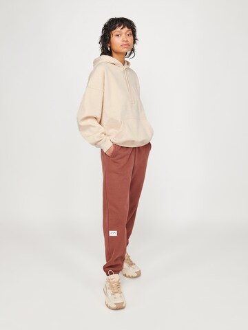 ABOUT YOU x VIAM Studio Hoodie 'Better' in Beige