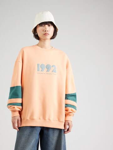 OH APRIL Sweatshirt '1992' in Orange