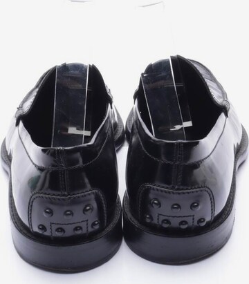 Tod's Flats & Loafers in 41 in Black
