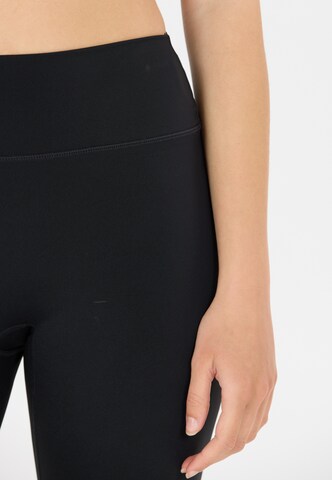 Athlecia Skinny Tights 'Blossom' in Braun