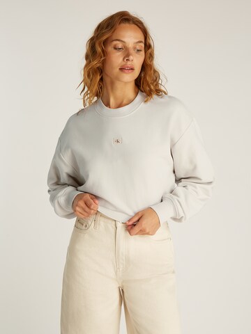 Calvin Klein Jeans Суичър в бежово: отпред