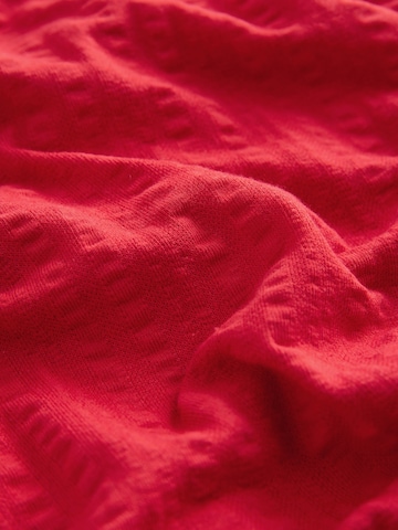 Combinaison Next en rouge