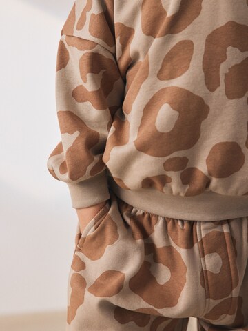 Next Облекло за бягане в бежово