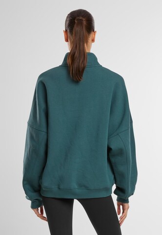 Sweat de sport Aim'n en vert