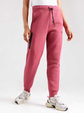 Nike Sportswear Tapered Nadrág 'TCH FLC' - rózsaszín: elől