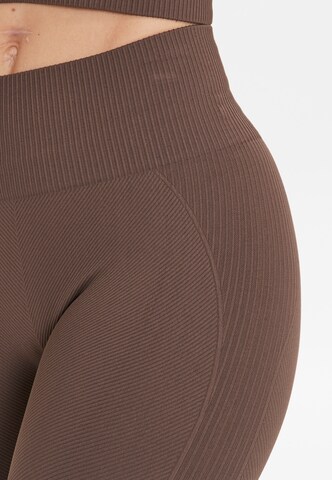 Athlecia Skinny Tights 'Flow' in Braun