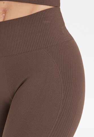 Athlecia Skinny Workout Pants 'Flow' in Brown