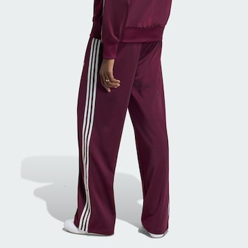 ADIDAS ORIGINALS - Pierna ancha Pantalón 'Firebird Adicolor' en rojo
